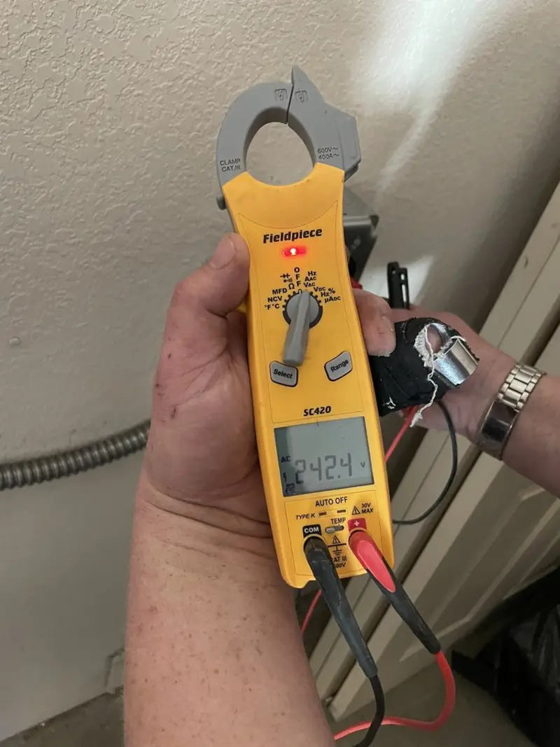 Voltage testing with clamp meter during Recessed Lighting Installation in Clarkston